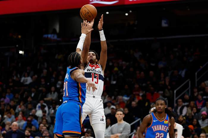 Washington Wizards guard Jordan Poole (13) shoots the ball over Oklahoma City Thunder guard Aaron Wiggins (21) in the third quarter at Capital One Arena.